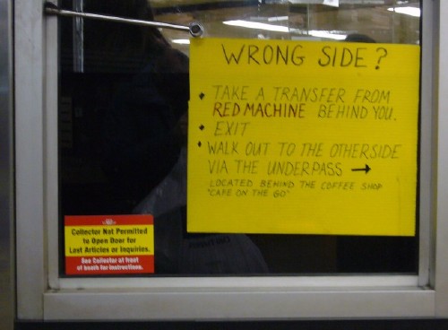 Handwritten sign is headlined WRONG SIDE ? and goes on for seven more lines