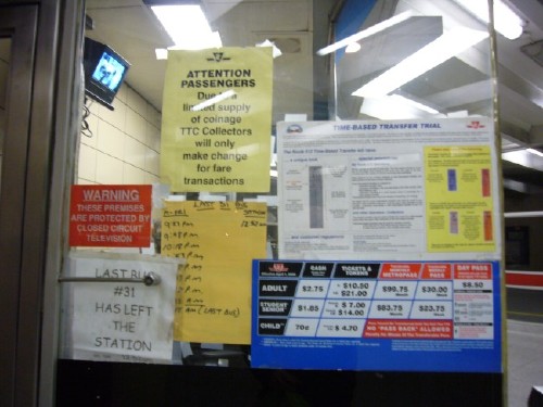 Farebooth with six signs, including one handwritten and one typeset in Comic Sans