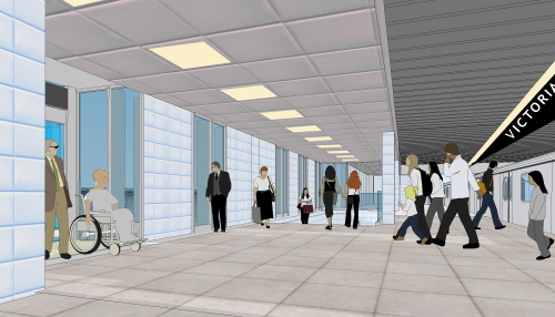 Station with powder-blue tiles, a person in a wheelchair leaving an elevator, and a sign with the off-angle word VICTORIA