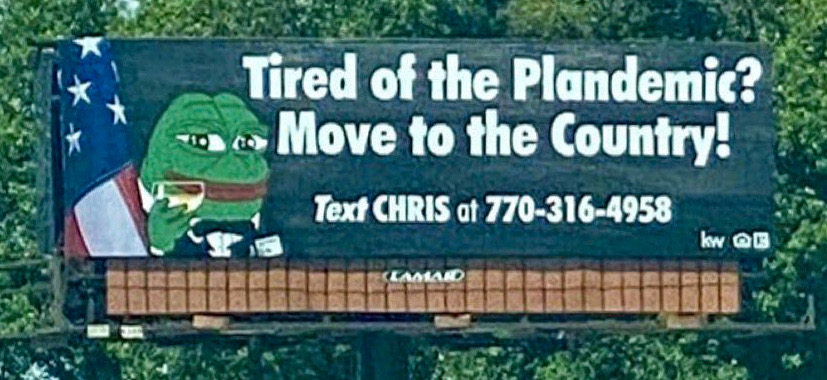 Billboard shows Stars and Stripes and Apu toasting us with a drink. Tired of the Plandemic? Move to the Country!